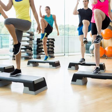 Fitness class exercising in the studio